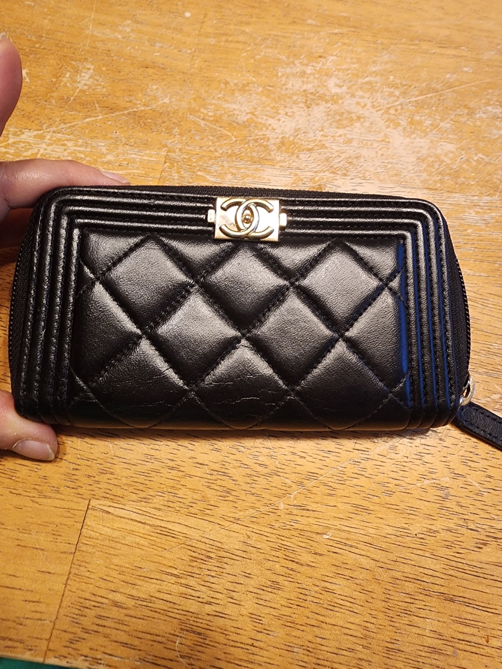 Chanel Boy quilted zip-around wallet in black leather with gold-tone hardware
